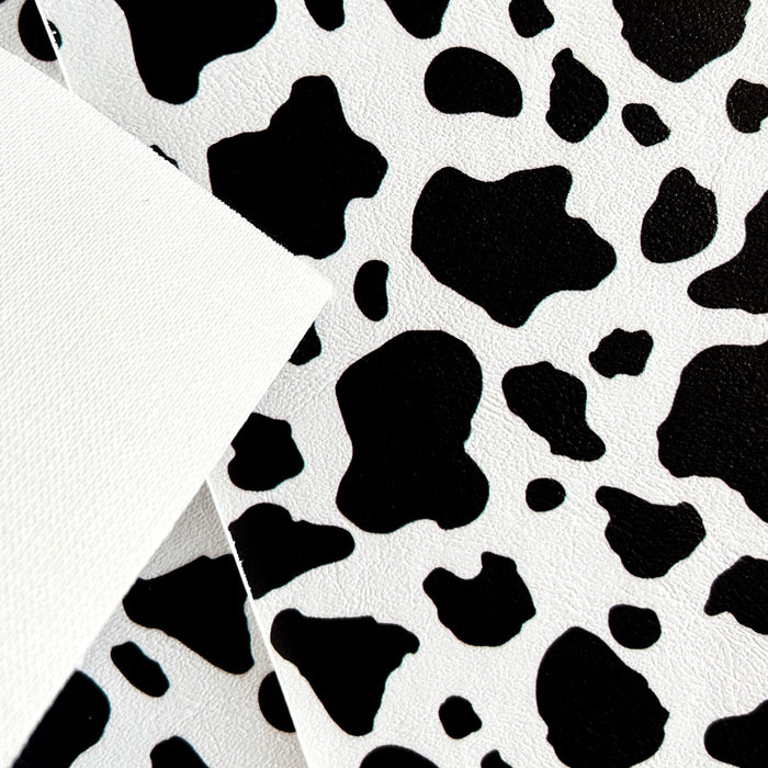 Irregular, Roundish Shapes of Black Color Printed on a White Marine Vinyl